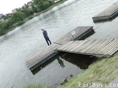 Sexy shaped young guy gets filmed peeing by the river