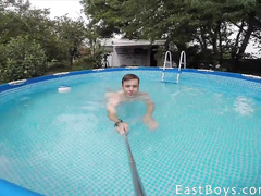 Young gay is making selfie pictures nude in the pool